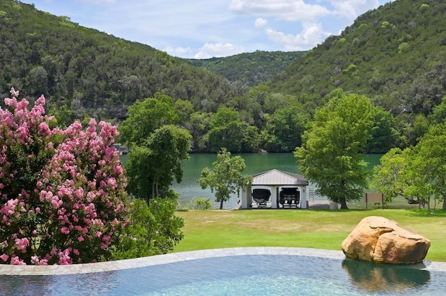 13414 Shore Vista Dr, Austin, TX 78732 - view of pool featuring a view of trees, a water and mountain view, a gazebo, and a yard
