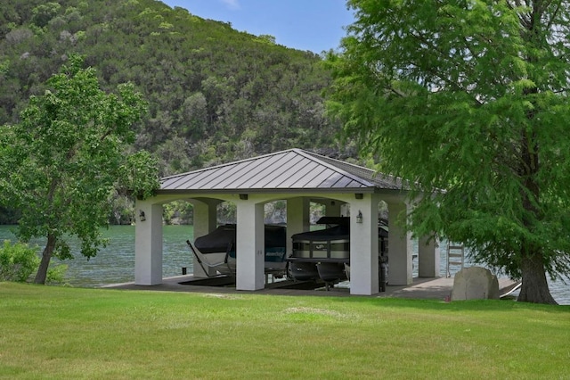 13414 Shore Vista Dr, Austin, TX 78732 - surrounding community with boat lift, a lawn, a boat dock, a forest view, and a carport