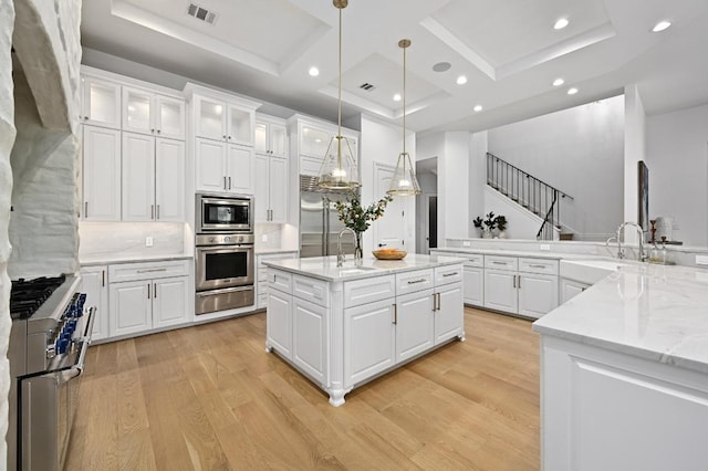 13414 Shore Vista Dr, Austin, TX 78732 - kitchen featuring stainless steel appliances, a warming drawer, coffered ceiling, light wood-style floors, and recessed lighting