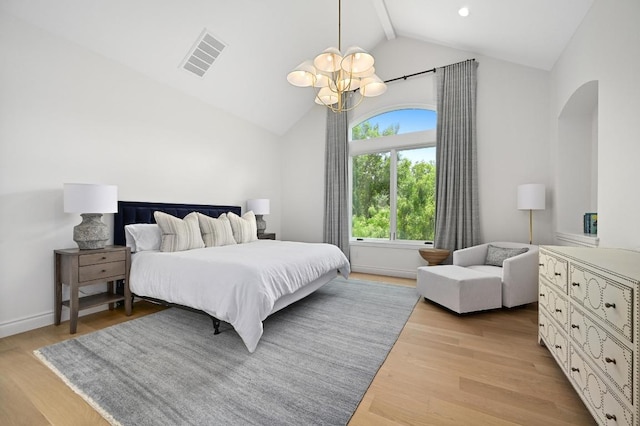 13414 Shore Vista Dr, Austin, TX 78732 - bedroom with a chandelier, arched walkways, beamed ceiling, wood finished floors, and high vaulted ceiling
