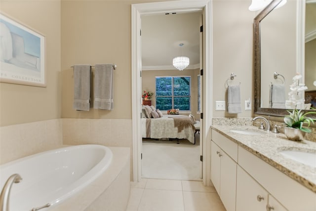 bathroom featuring vanity, ornamental molding, tile patterned floors, and a relaxing tiled tub