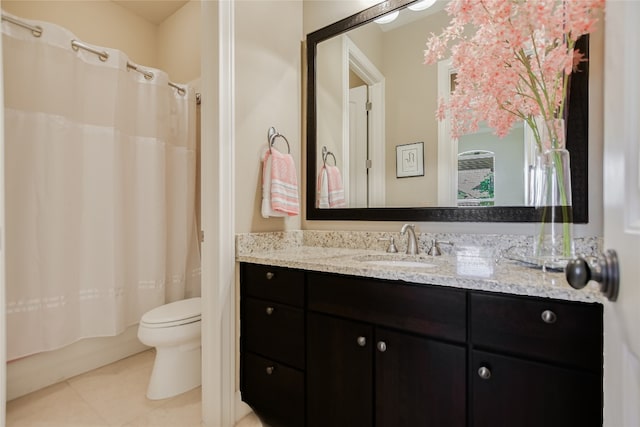 full bathroom with tile patterned flooring, toilet, shower / tub combo with curtain, and vanity