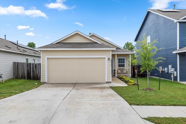 view of front of home with a garage and a front lawn