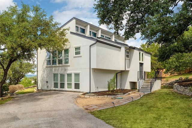 exterior space with a front lawn