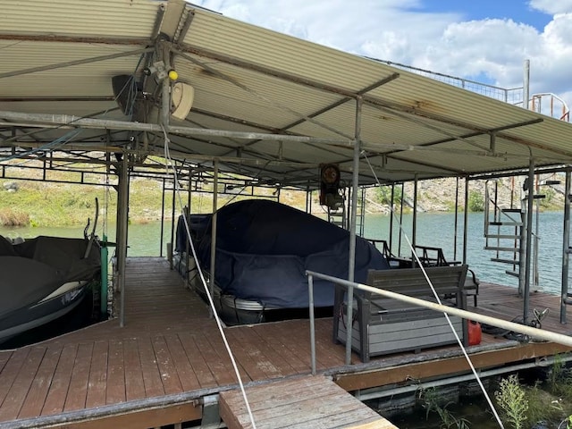 dock area with a water view