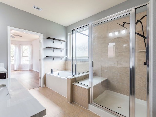 bathroom with vanity, separate shower and tub, and tile patterned floors