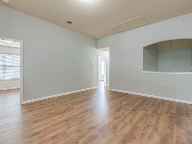 unfurnished room featuring light hardwood / wood-style floors