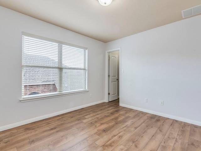 unfurnished room featuring hardwood / wood-style floors