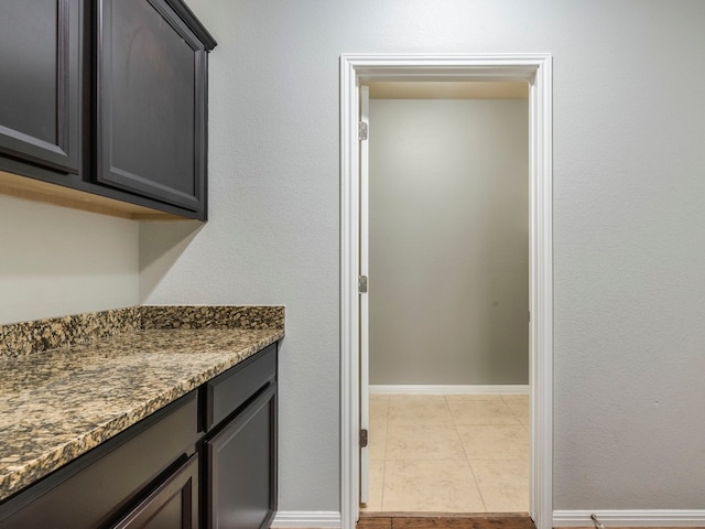 bathroom featuring tile patterned flooring and vanity