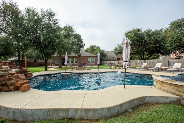 view of swimming pool with a patio area