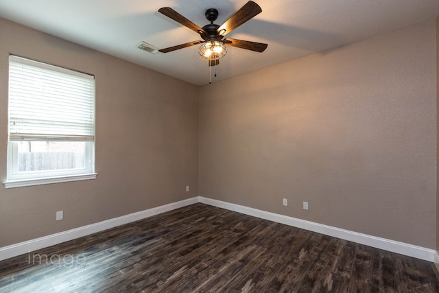 unfurnished room featuring ceiling fan and dark hardwood / wood-style flooring