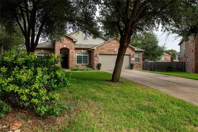 view of front of home featuring a garage and a front yard