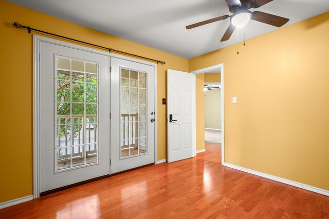 doorway featuring french doors, hardwood / wood-style flooring, and ceiling fan