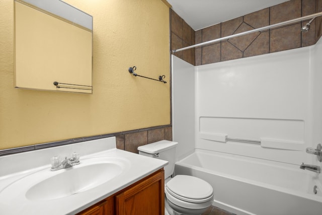 full bathroom with vanity, toilet, tile walls, and bathing tub / shower combination