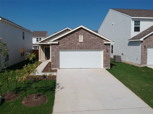 view of front of property featuring cooling unit and a front lawn