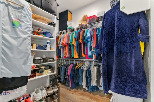 walk in closet featuring hardwood / wood-style floors