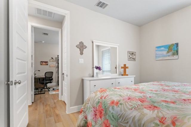 bedroom with light hardwood / wood-style flooring