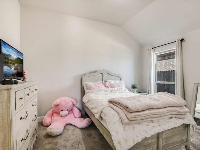 bedroom featuring lofted ceiling and carpet floors