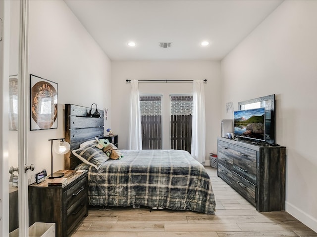 bedroom featuring light hardwood / wood-style floors