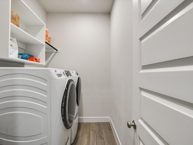 laundry area featuring wood-type flooring and washer and dryer