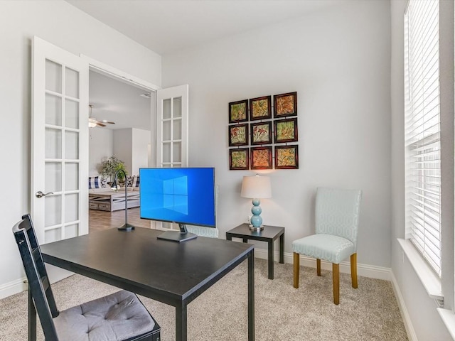 carpeted office featuring a ceiling fan, french doors, and baseboards