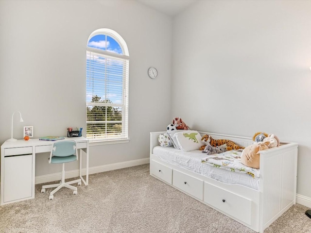 bedroom featuring carpet and baseboards