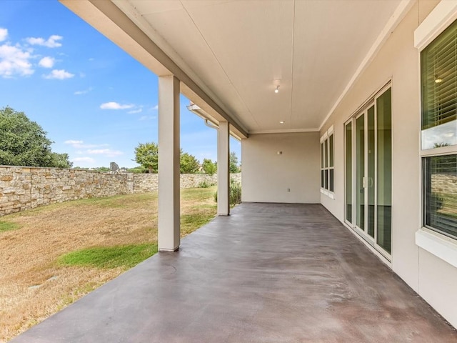 view of patio featuring fence