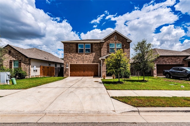 front of property featuring a garage and a front lawn