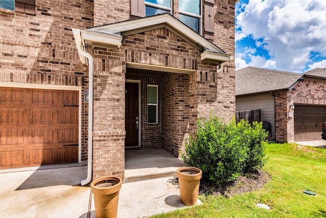 doorway to property with a lawn