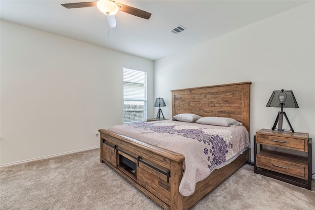 bedroom featuring light carpet and ceiling fan