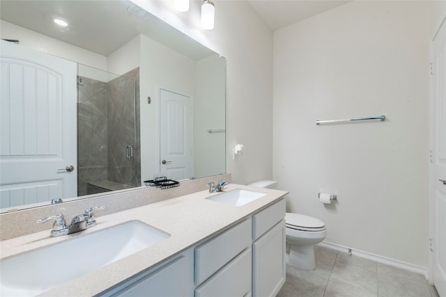 bathroom featuring a shower with door, vanity, toilet, and tile patterned flooring