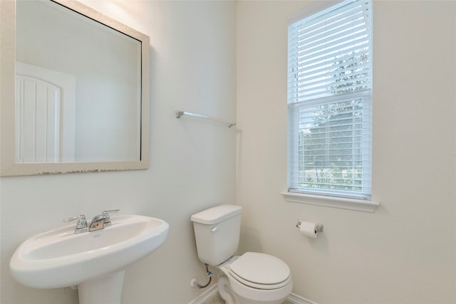 bathroom featuring toilet and sink