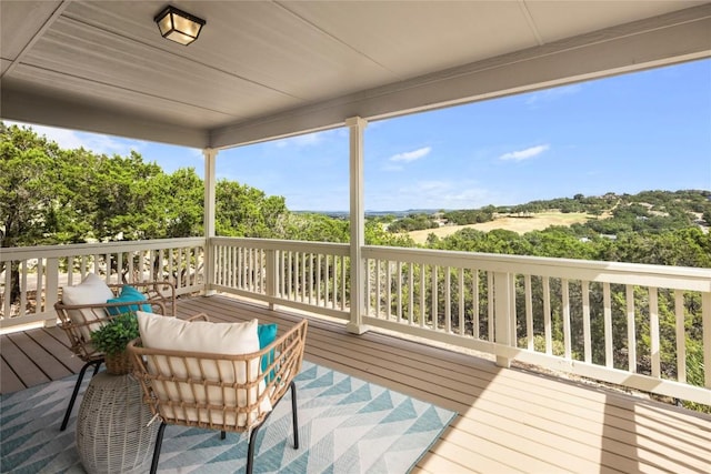 wooden deck with an outdoor hangout area