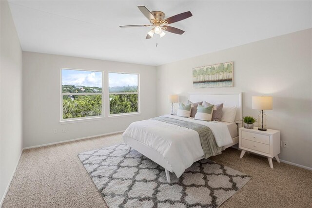 bedroom featuring carpet flooring, ceiling fan, and baseboards