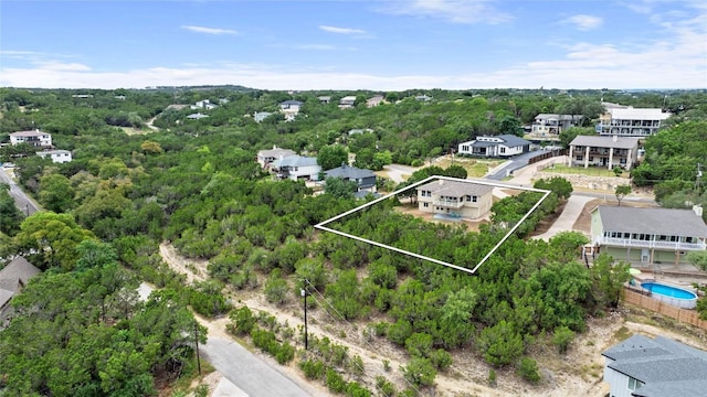 drone / aerial view featuring a forest view