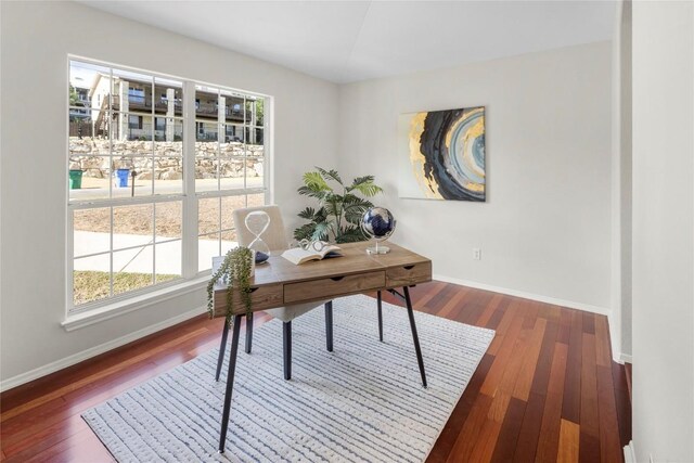 office featuring baseboards and wood finished floors