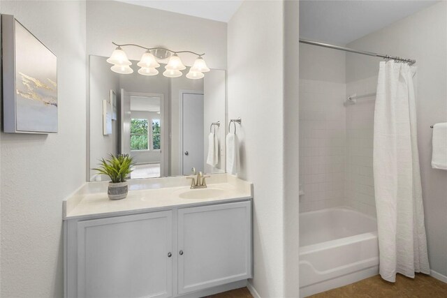 bathroom featuring shower / bathtub combination with curtain and vanity