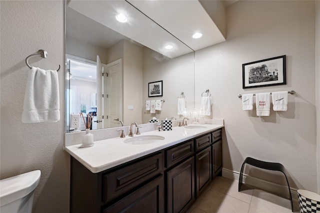 bathroom featuring tile patterned floors, toilet, and vanity