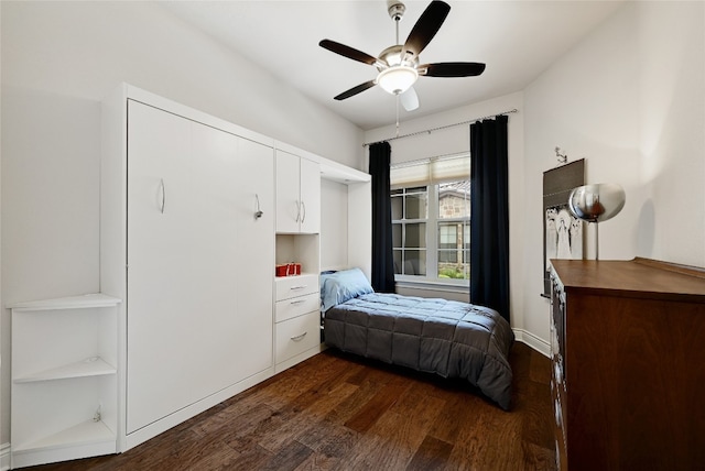 bedroom with dark wood-type flooring and ceiling fan