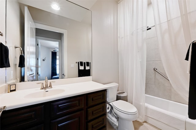 full bathroom with vanity, toilet, and shower / tub combo