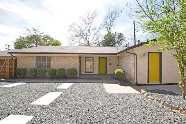 view of front of home featuring brick siding