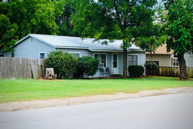 ranch-style home with a front yard