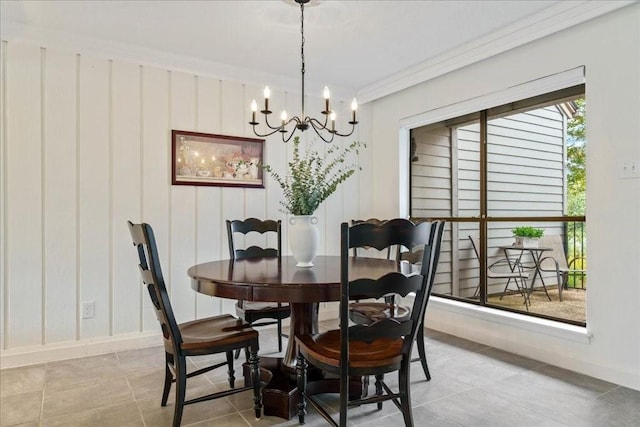 tiled dining space with an inviting chandelier and crown molding