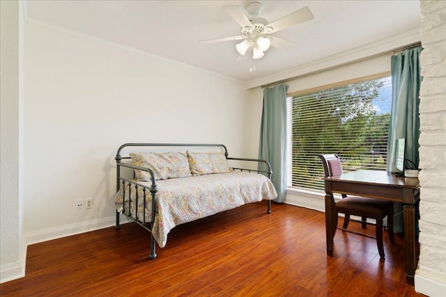 bedroom with crown molding, ceiling fan, and wood-type flooring