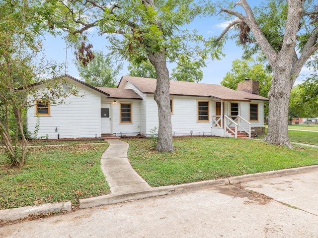 ranch-style house with a front lawn