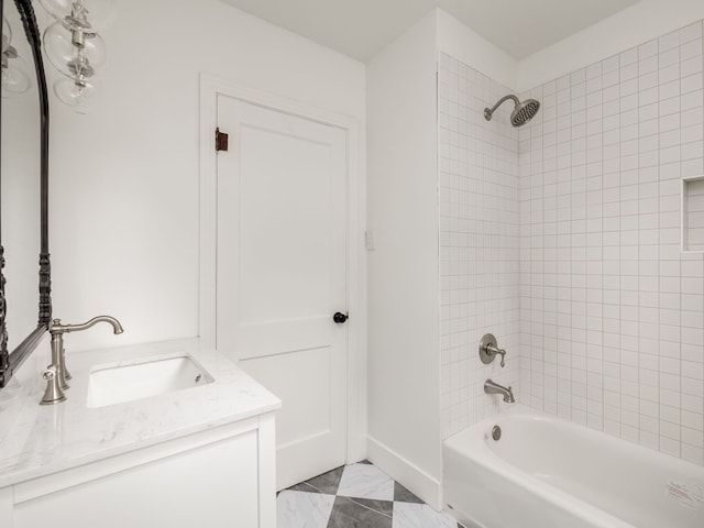 bathroom with vanity and tiled shower / bath