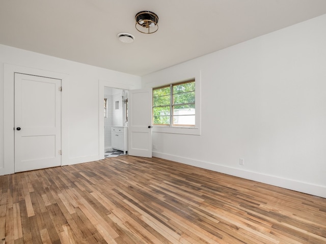 empty room featuring wood-type flooring