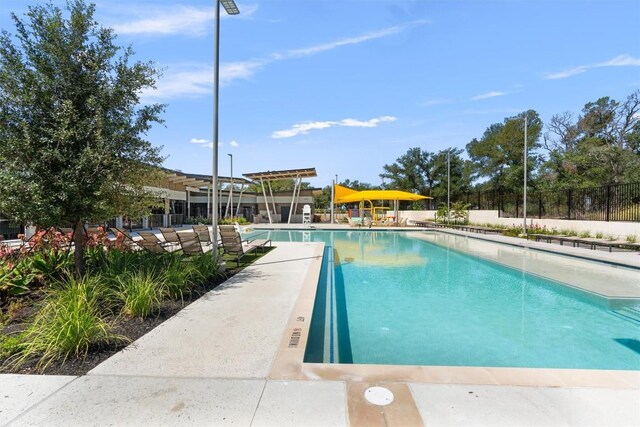 view of swimming pool with a patio