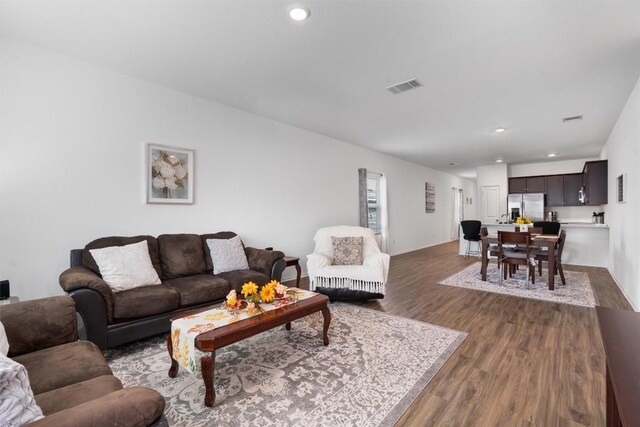 living room featuring dark wood-type flooring