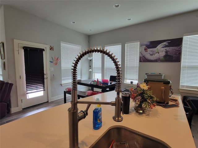 workout room with plenty of natural light and hardwood / wood-style flooring